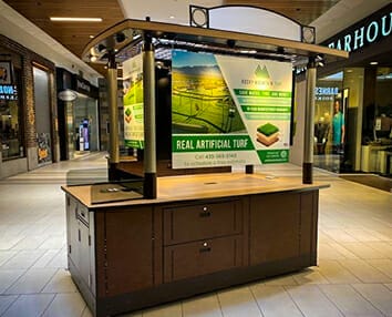 Printed signage for a mall kiosk.