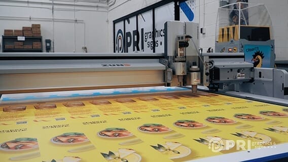 Wide format commercial printer printing out a project
