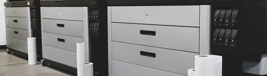 Three stacks of storage cabinets at a commercial printing facility