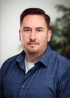 Headshot of Luke Malone, Director of Marketing for PRI Graphics & Signs.