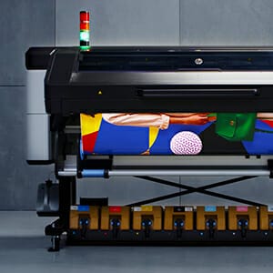 Large format color printer printing a project.