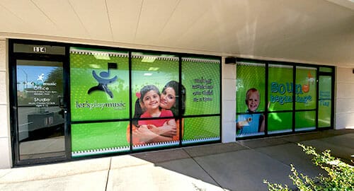 Window graphics wrap for a children's music learning center.