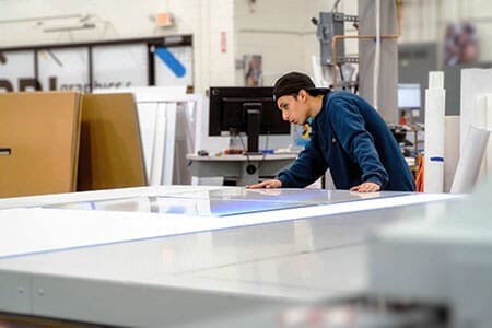 PRI Graphics flatbed operator printing signs