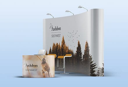 Curved trade show display and smaller counter display, both with full printed graphics for the Audubon Southwest.