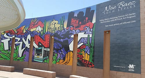 Large alumigraphics wall wrap on brick wall for Valley Metro.