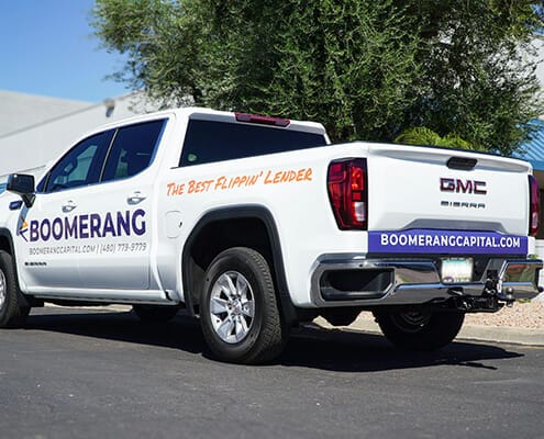 Back and side view of truck graphics for Boomerang Capital Partners