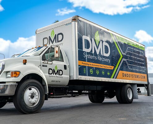 Side and front view of large box truck full wrapped with vinyl graphics for DMD