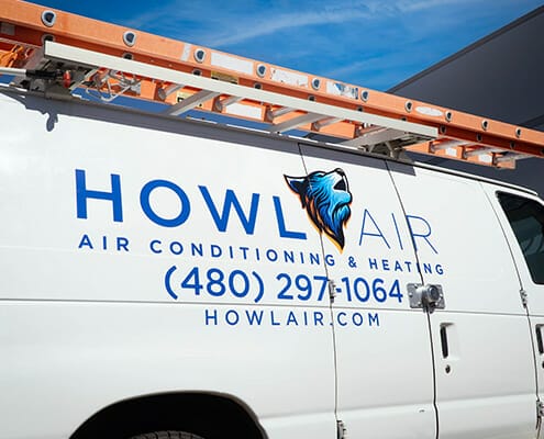 Vinyl graphics on the side of a work van for Howl Air