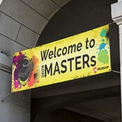 Hanging banner for an event welcoming guests to the 2019 Masters conference.
