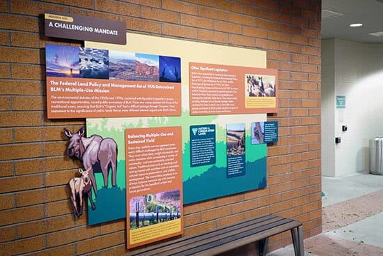 Interior printed wall graphics on a brick wall.