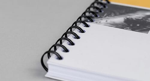 Close-up of a coil-bound booklet.