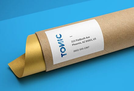 Shipping label on a cardboard tube.