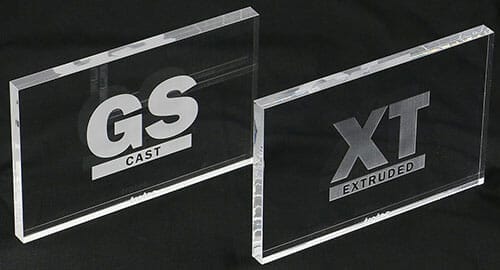 Polished-edged clear acrylic rectangles with logos etched into them.