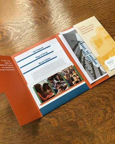 Presentation folder currently opened up with flyers inside.