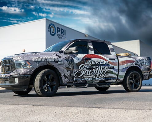 Full truck wrap custom designed for fallen soldiers with text on side stating "live a life worthy of their sacrifice"