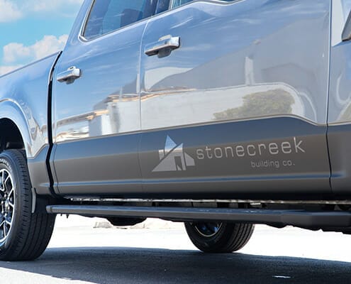 Stonecreek building company logo vinyl graphic on the side of a truck